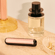 Painéis frontais Rose Gold com padrão brilhante para Ploom AURA colocados numa mesa de maquilhagem